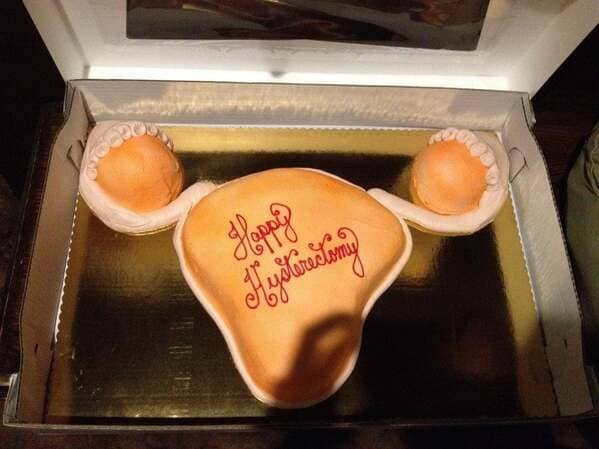 Anatomically shaped uterus cake with Happy Hysterectomy text.