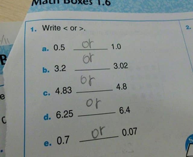 Math worksheet where student wrote the word "or" instead of using greater or less signs.