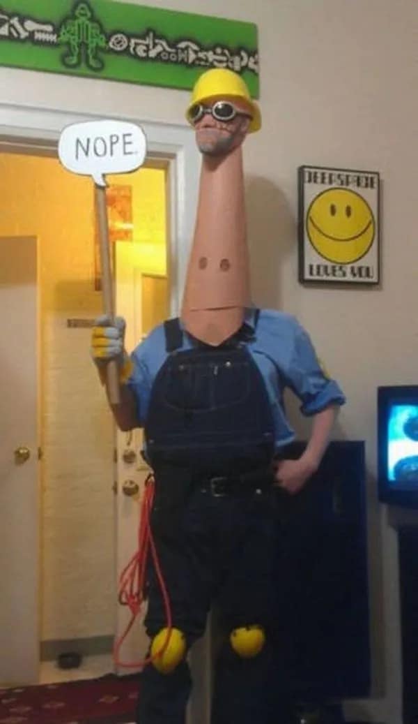 Team Fortress 2 Engineer cosplay with long neck holding nope sign funny meme.