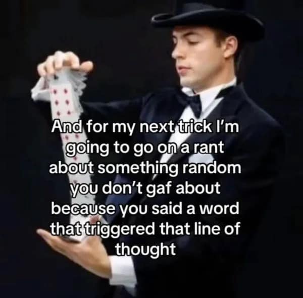 Magician holding cards joking about going on a random rant next.