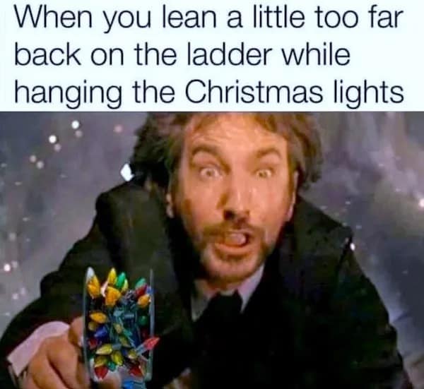 Hans Gruber from Die Hard falling from building holding Christmas lights.