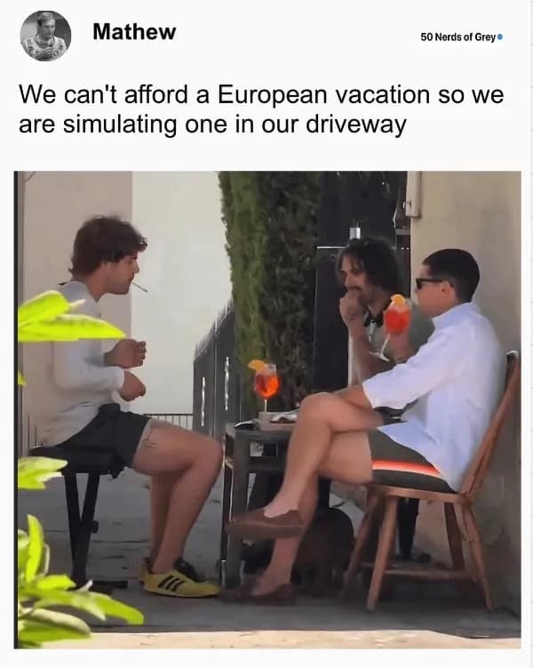 Three men drinking Aperol spritzes in a driveway to simulate a European vacation.