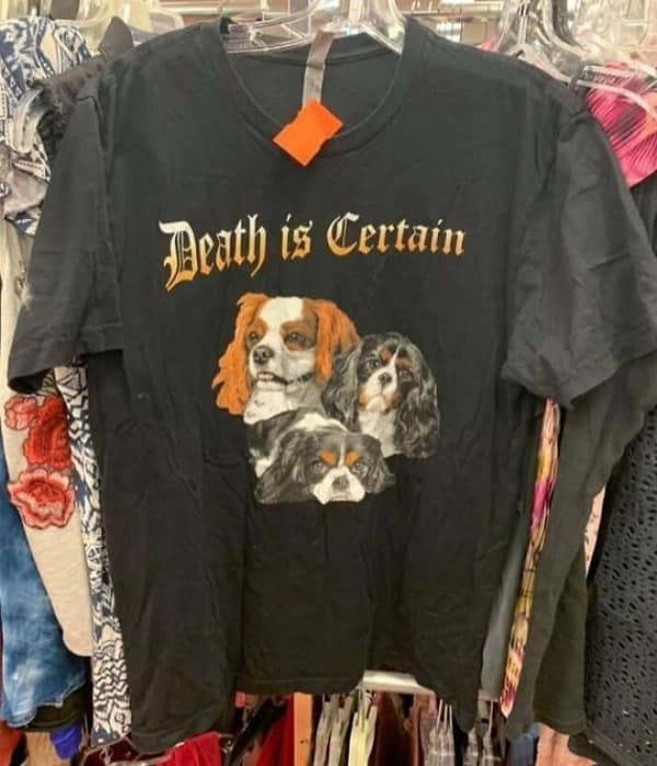 A funny thrift store find t-shirt featuring cute spaniels under the gothic text Death is Certain.