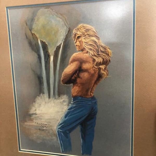 A funny thrift store find painting of a muscular lion-man hybrid wearing blue jeans.