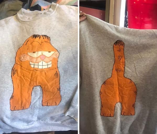 A funny thrift store find sweatshirt featuring a handmade Garfield on the front and his butt on the back.