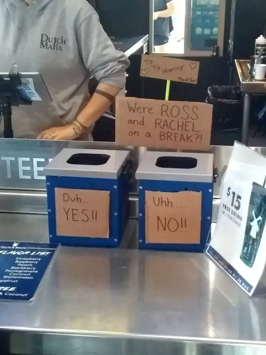 A creative tip jar setup asking customers to vote if Ross and Rachel were on a break.