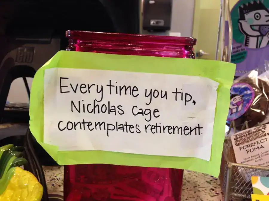 A funny tip jar sign claiming Nicholas Cage contemplates retirement every time you tip.