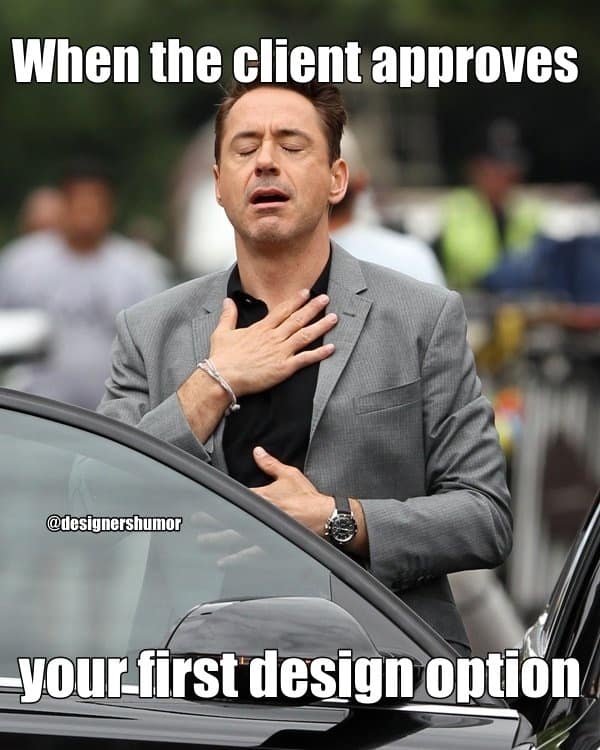 A graphic design meme of Robert Downey Jr looking relieved about a client approving the first draft