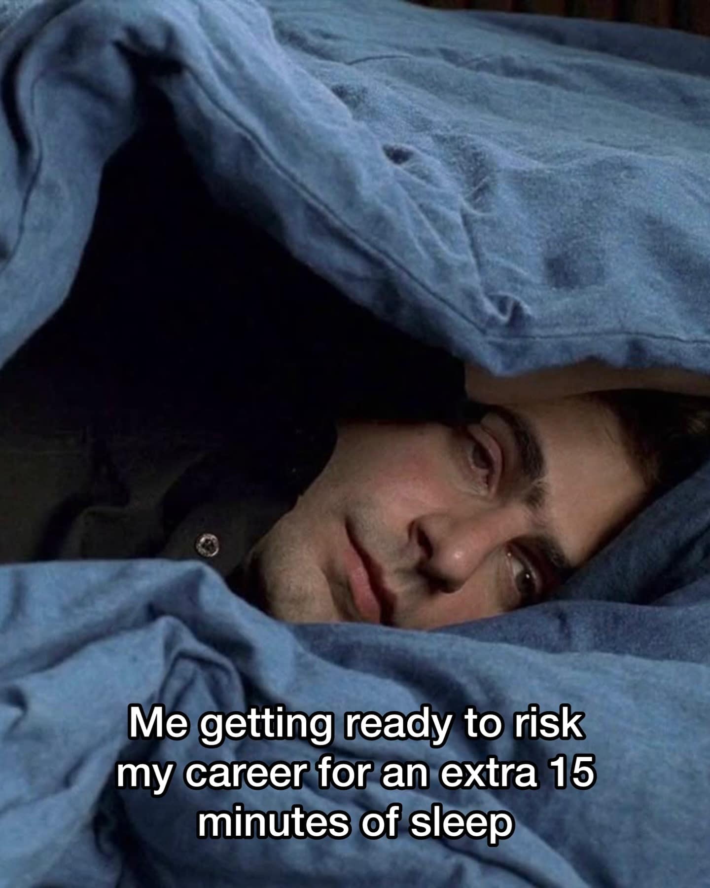 A hilarious meme of a man in bed debating risking his career for 15 minutes of sleep.