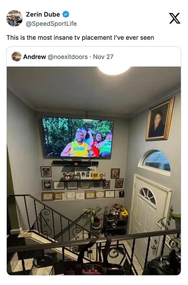 TV mounted dangerously high over a staircase in a funny meme about interior design.