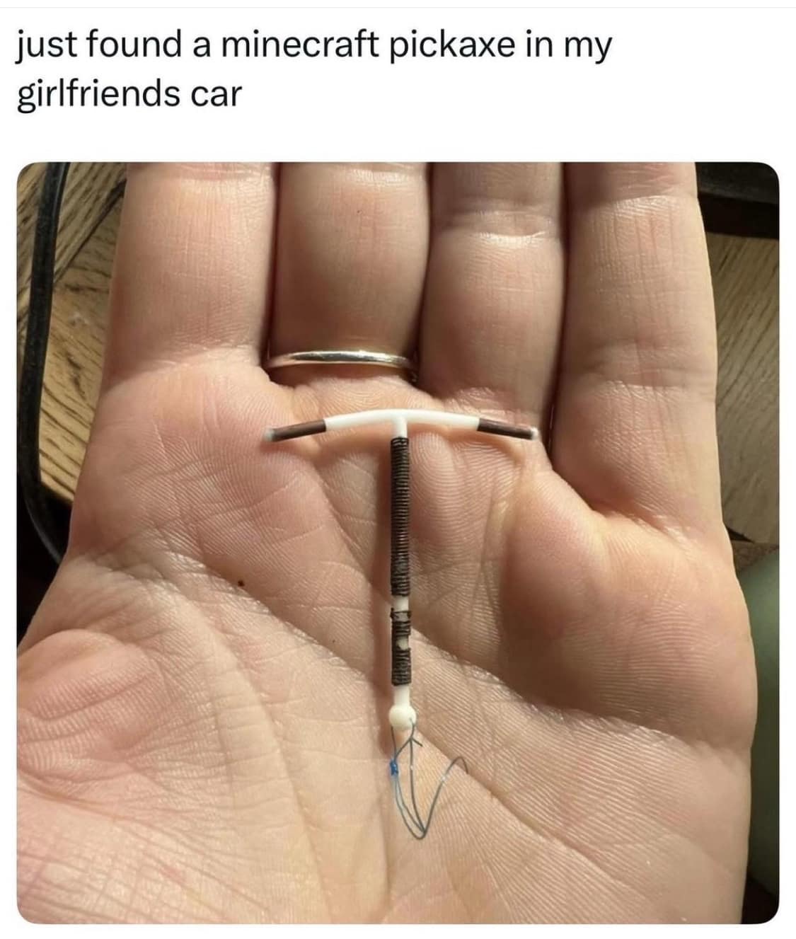 A hilarious meme comparing a copper IUD to a Minecraft pickaxe found in a car.