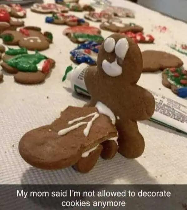 A hilarious meme of a gingerbread man appearing to do something inappropriate to another cookie.