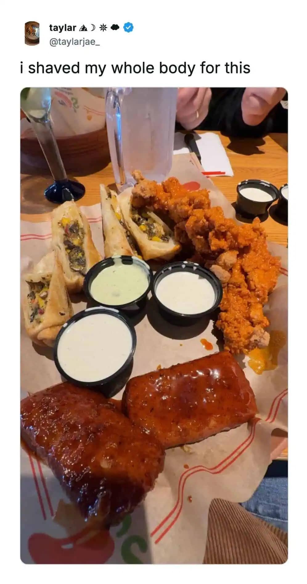 A funny meme tweet showing a plate of appetizers captioned I shaved my whole body for this.