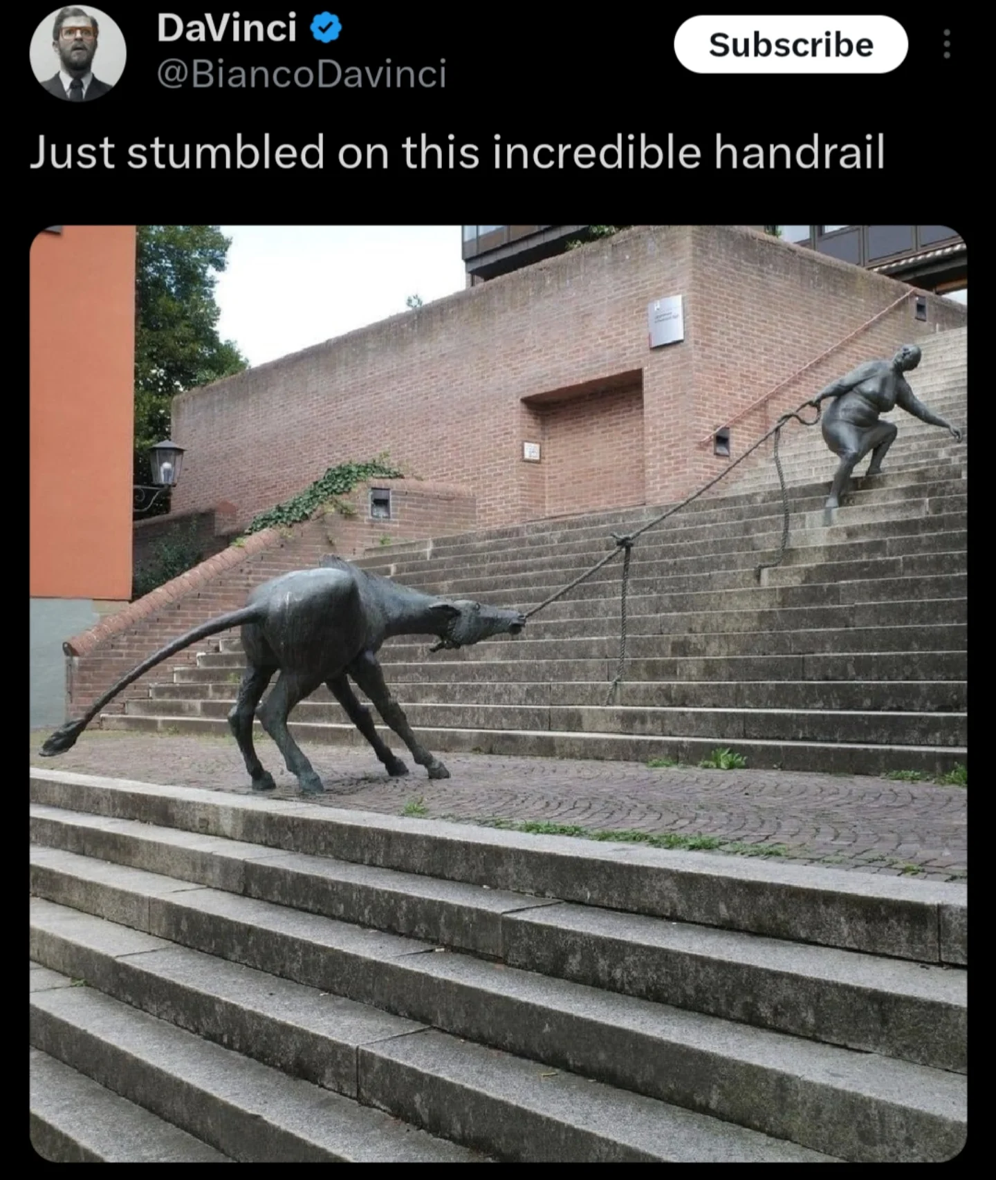 A hilarious meme of a handrail designed to look like a woman pulling a stubborn donkey.