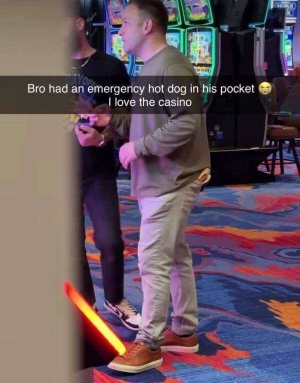 A funny meme of a man with an emergency hot dog in his back pocket at a casino.