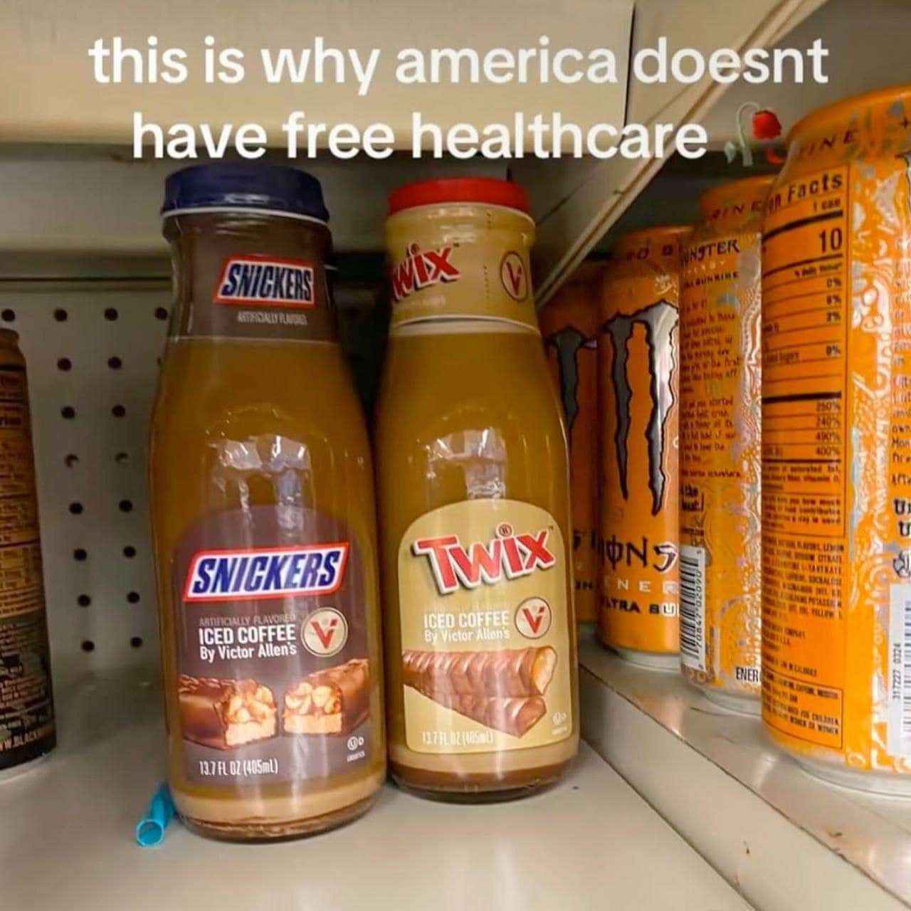 A funny meme of Snickers and Twix flavored iced coffees on a store shelf.