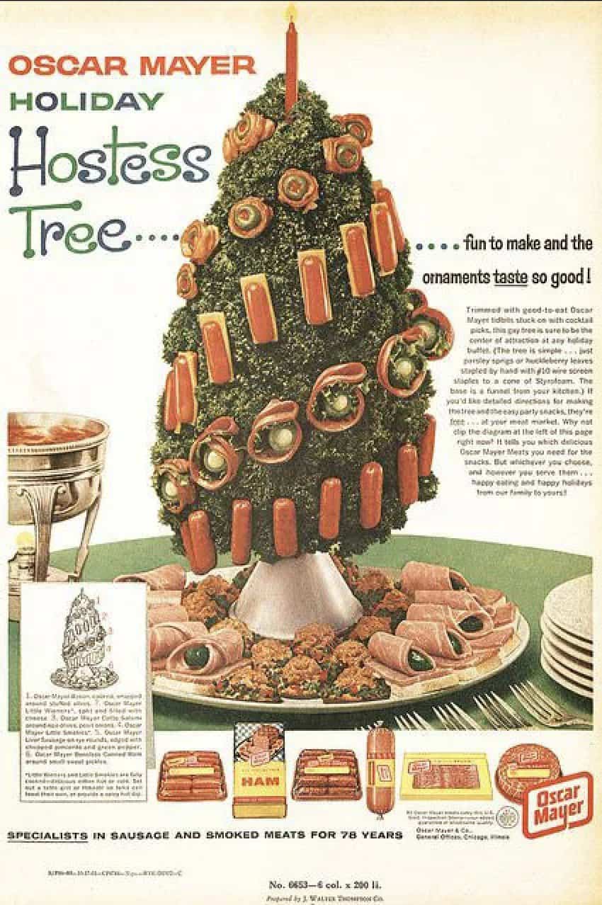 A retro christmas photo of an Oscar Mayer meat tree centerpiece.