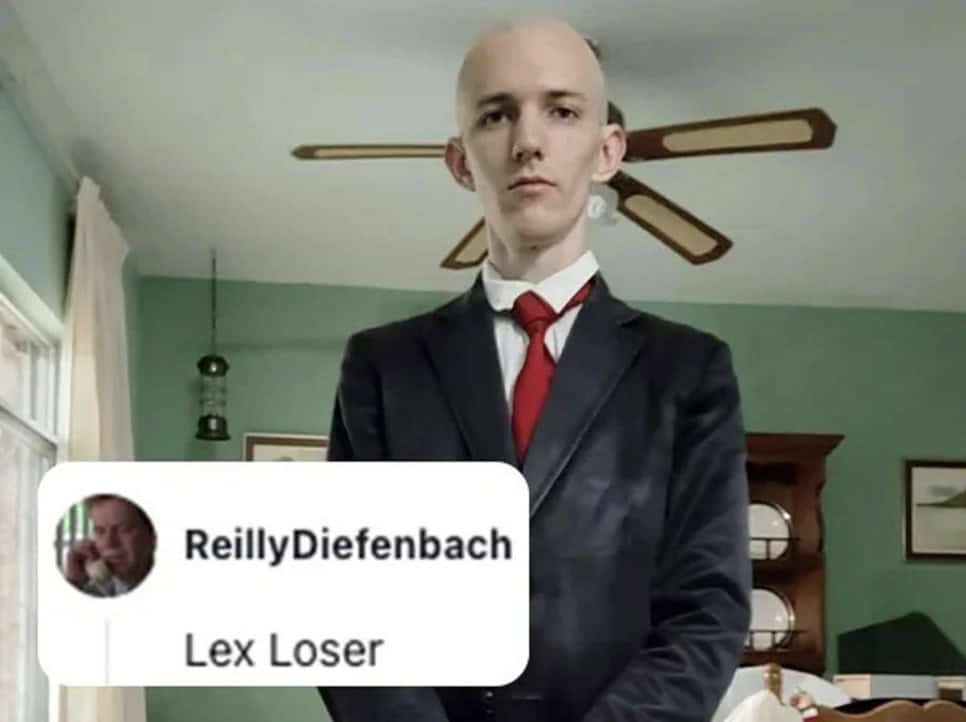 A savage roast calling a bald man in a suit Lex Loser referencing Lex Luthor.