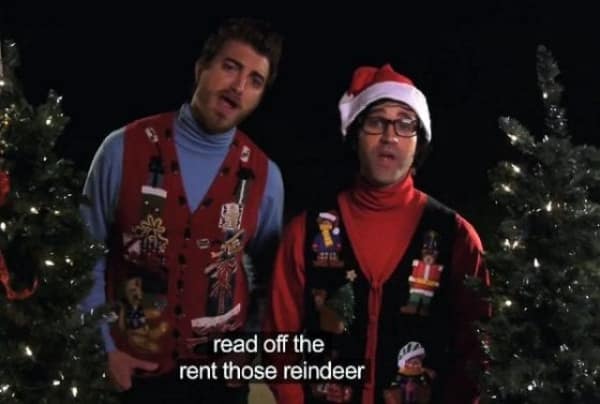 Two men singing Christmas carols with badly misheard lyrics in the TV captions.