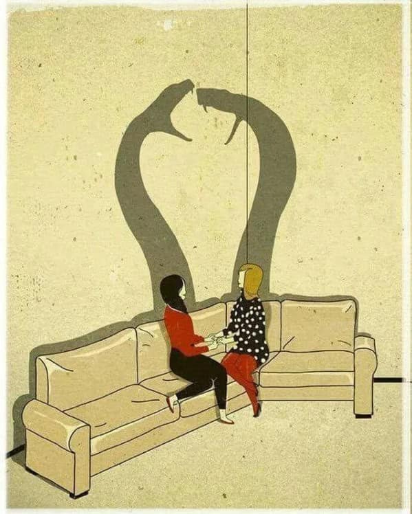 A thought provoking comic showing two women holding hands while their shadows appear as attacking snakes.