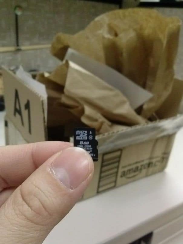 A product packaging fail of a tiny micro SD card shipped in a massive cardboard box.