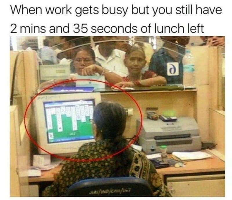 Office worker playing Solitaire on an old monitor in a work meme.