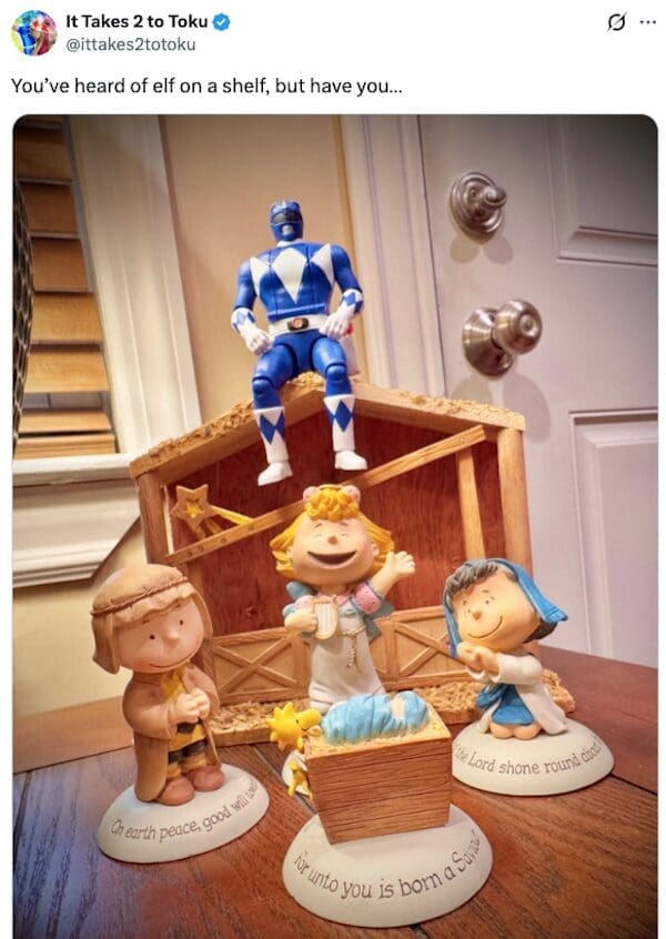 A funny meme showing a Blue Power Ranger sitting on top of a Christmas nativity manger