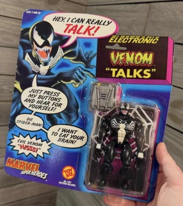 A sealed Venom "Talking" action figure from the Marvel Super Heroes line, a classic 90s toy.