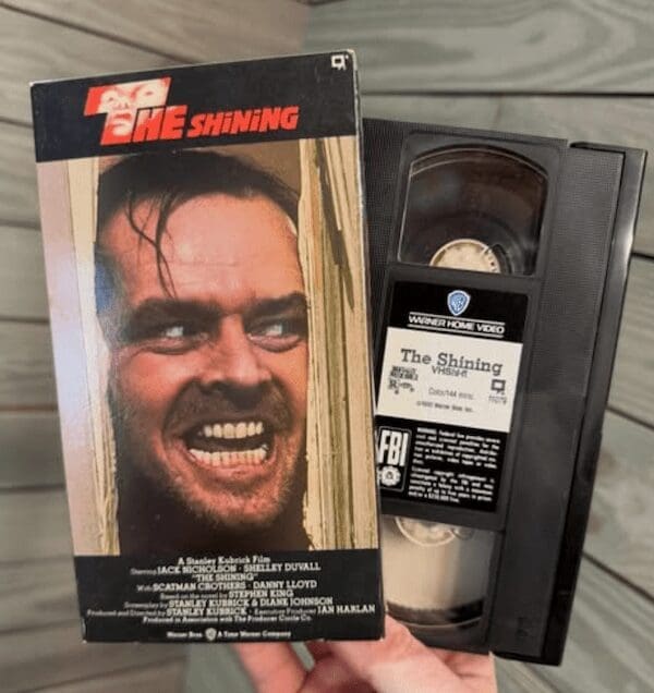 A VHS tape of the movie The Shining, a nostalgic collectible often found alongside retro toys.