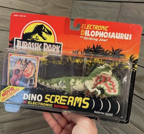 A sealed Jurassic Park Electronic Dilophosaurus action figure, a high-tech 90s toy by Kenner.
