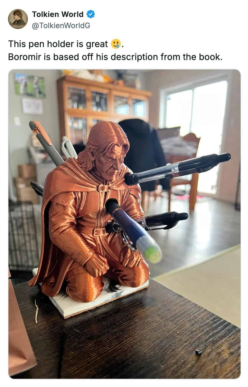 A lotr meme showing a 3D printed Boromir pen holder where pens pierce his chest like arrows.