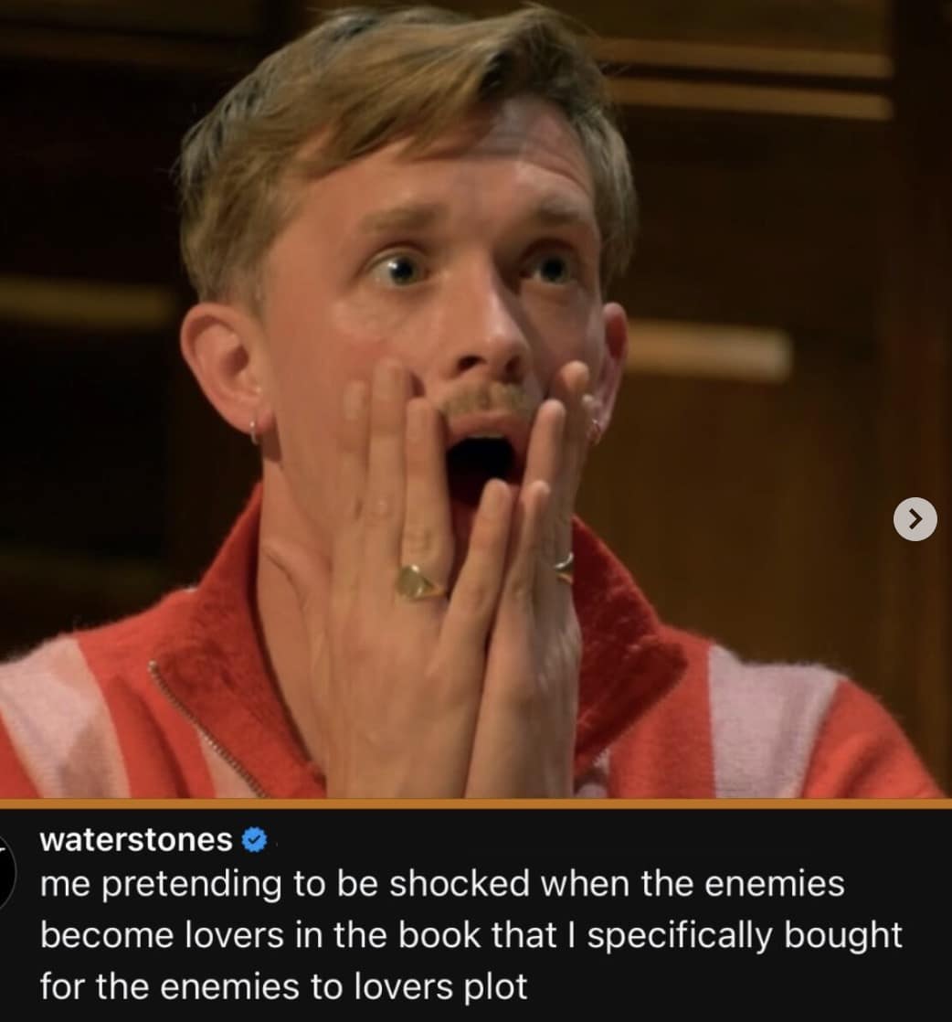 A The Traitors UK meme of a contestant holding his face in fake shock, captioned about reading an "enemies to lovers" plot twist you expected.