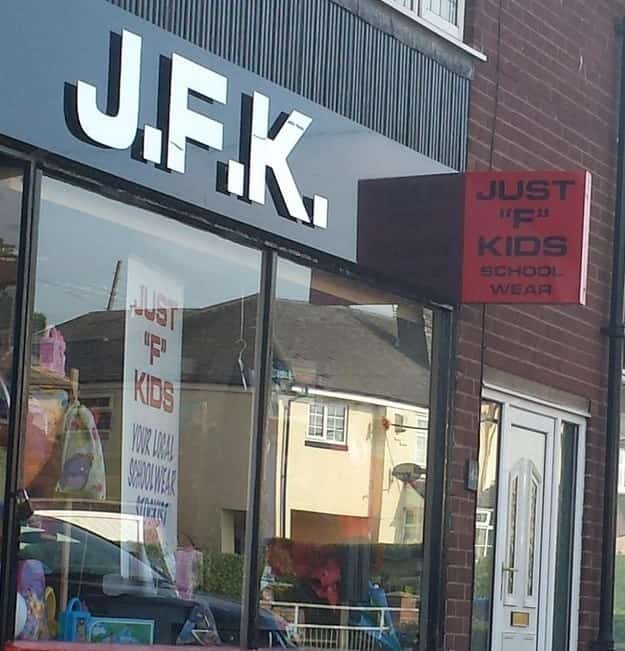 Storefront sign for J.F.K. school wear which stands for Just F Kids.