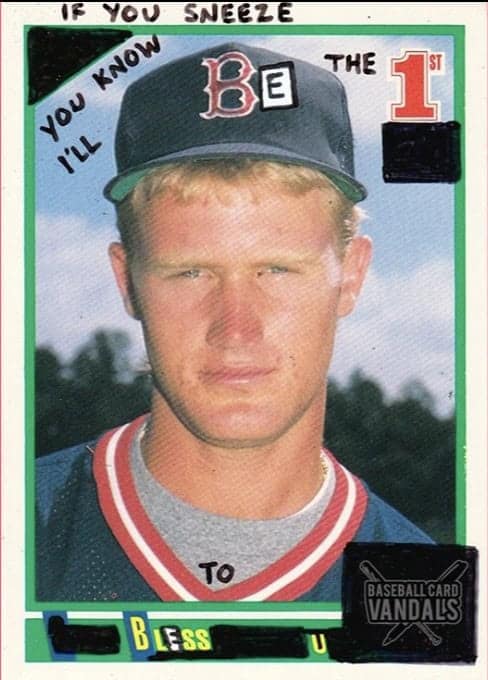 A Boston Red Sox card by baseball card vandals where the player promises to be the first to "bless u" if you sneeze.