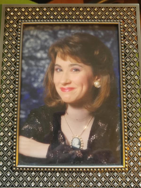 Framed glamour shot of woman with cameo necklace blunder years.