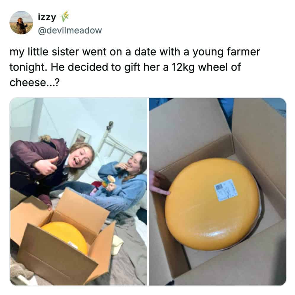 A cheese meme tweet by izzy showing two girls laughing over a 12kg wheel of cheese received as a first-date gift.