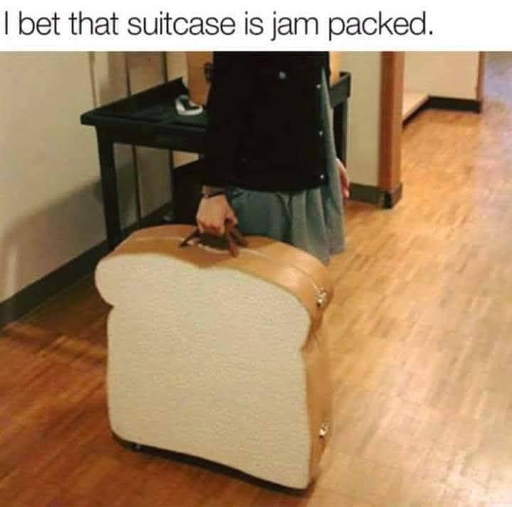 A classic meme photo of a bread-shaped suitcase with a pun about it being "jam packed".