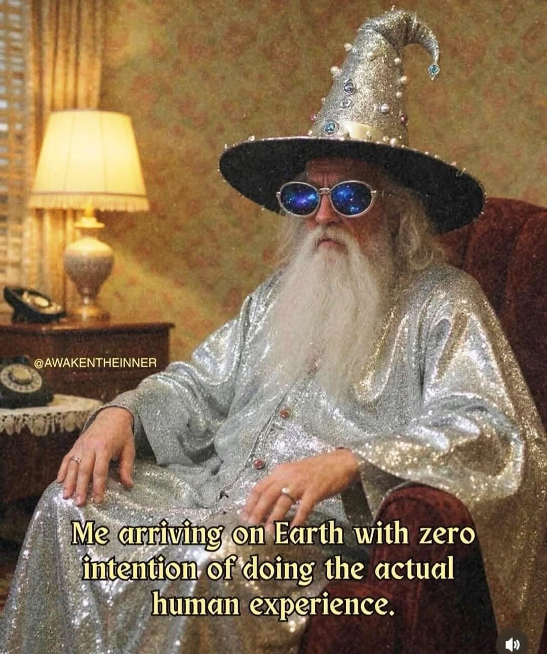 A wizard with sunglasses and a sparkly beard captioned about arriving on Earth with zero intention of participating.