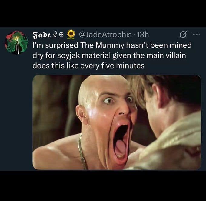 A viral tweet comparing the villain from The Mummy unhinging his jaw to a soyjak meme face.