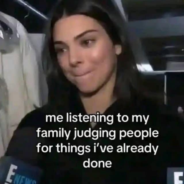 A classic meme of Kendall Jenner smirking while listening to family judge people for things she has done.