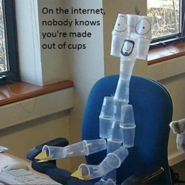 A classic meme of a figure constructed entirely out of clear plastic cups sitting in an office chair.