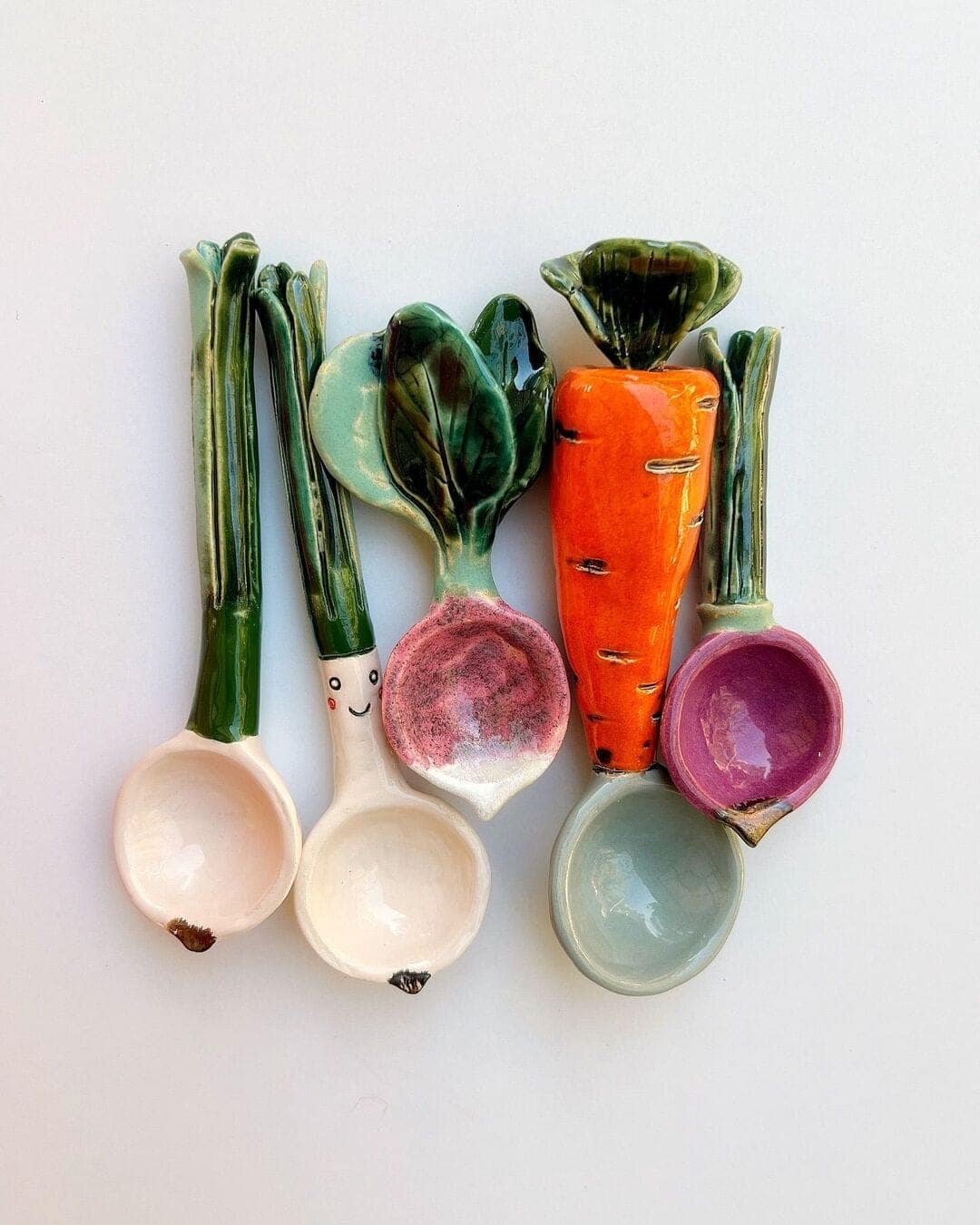 Ceramic measuring spoons shaped like leeks, radishes, and carrots displaying awesome interior design details.