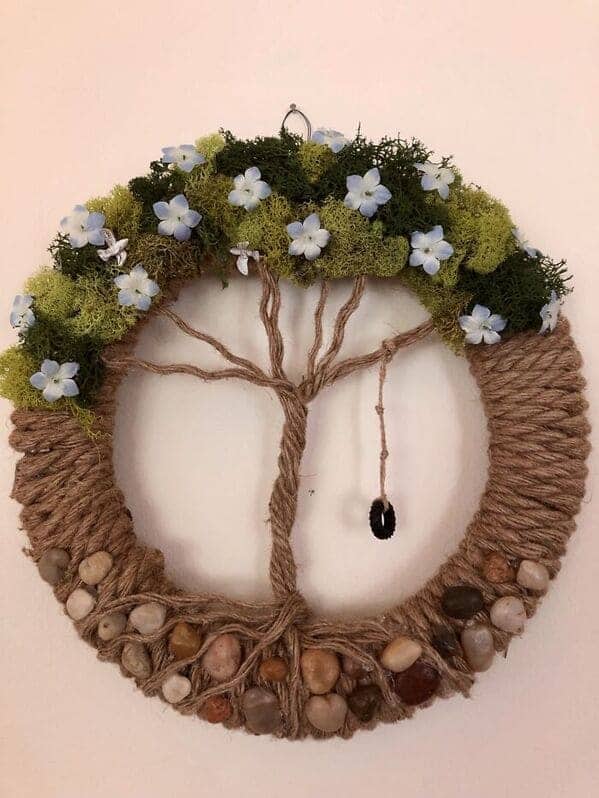 Handmade rope wreath with moss blue flowers and miniature tire swing cottagecore crafts
