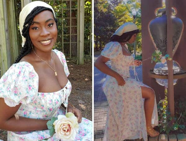 Woman in vintage floral dress and headscarf posing in garden cottagecore fashion
