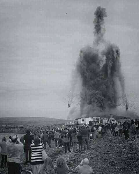 Massive column of dark smoke and debris rising from the ground in the shape of a giant humanoid.
