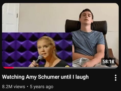 A funny youtube thumbnail showing a man asleep in a chair with the title "Watching Amy Schumer until I laugh."