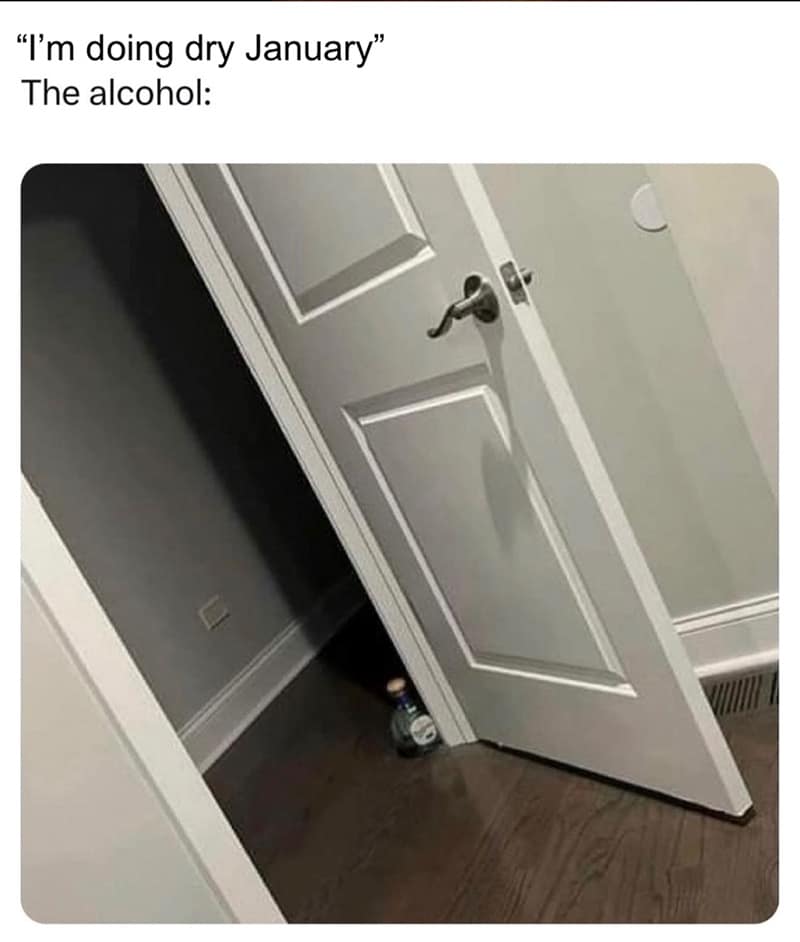 A bottle of alcohol peeking through a cracked doorframe watching someone do Dry January.