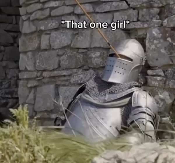 Knight in armor slumped against a wall with an arrow shot through the helmet visor.