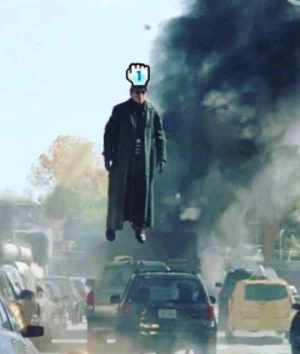 Doctor Octopus floating in mid-air with a computer mouse cursor clicking on his head.