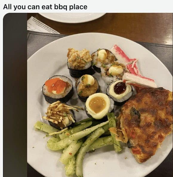 All you can eat plate with sushi pizza and crab sticks.